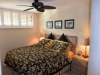 Kihei Surfside Resort unit 208 bedroom and shuttered windows view