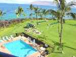 Heated pool and immaculate lawn of the Kihei Surfside Resort